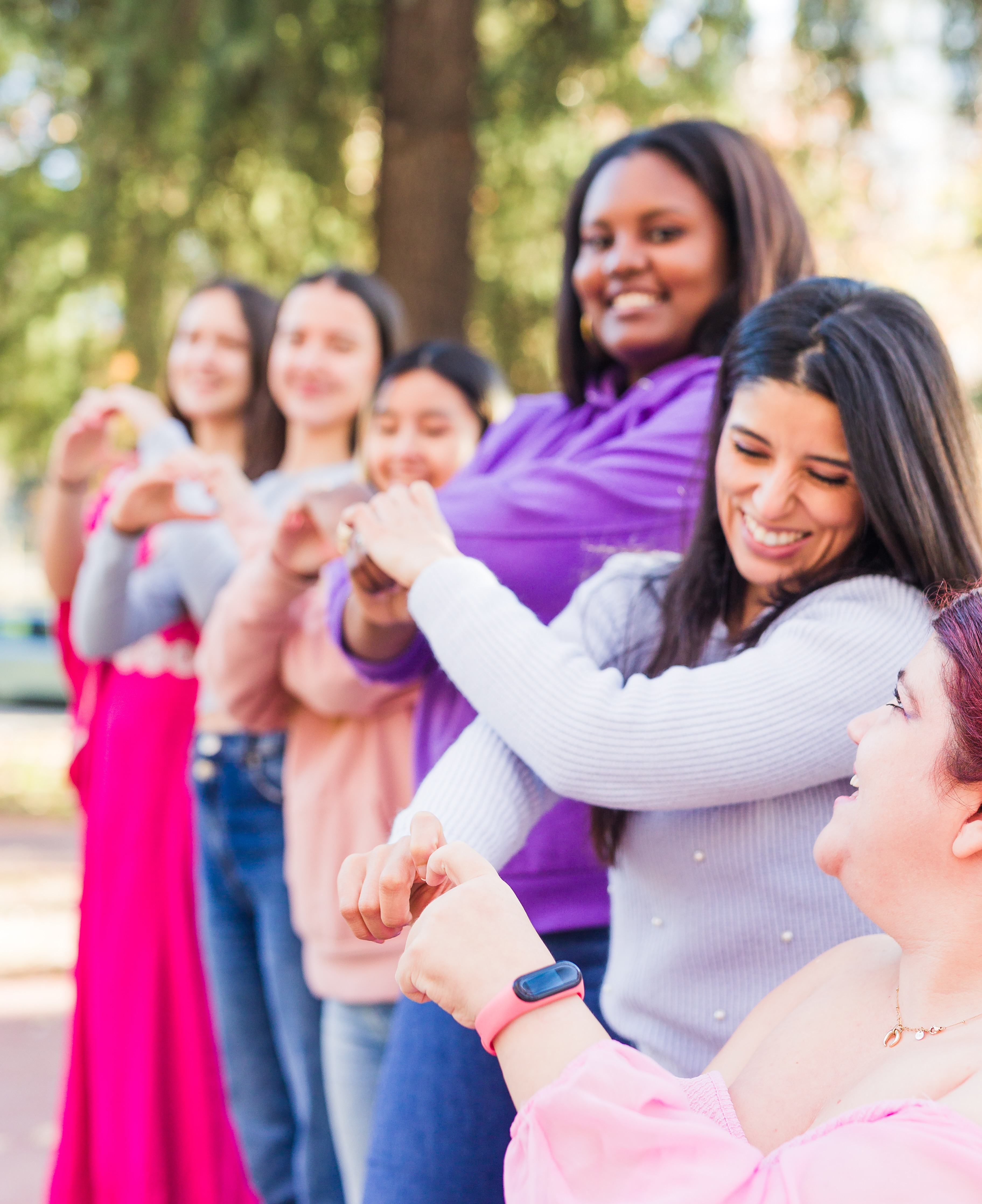A group celebrating outdoors at a school fundraising event